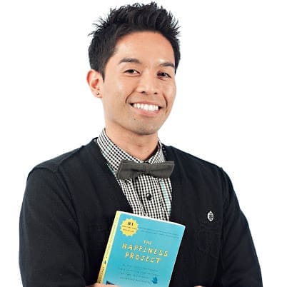 Danny Batimana holding The Happiness Project in a 2012 Dance Mogul archive image